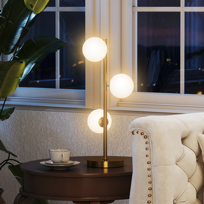 Настільна лампа з трьома сферичними плафонами, міцний сталевий постамент, патрони G9, розміри 24 x 24 x 53 см, латунь.