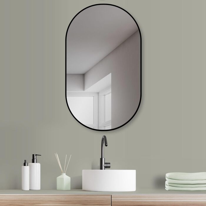 Дзеркало настінне овальне HOKO Design 45x75 см з металевим матовим каркасом. Можлива вертикальна та горизонтальна установка. Підходить для ванної кімнати, коридору, спальні та вітальні.